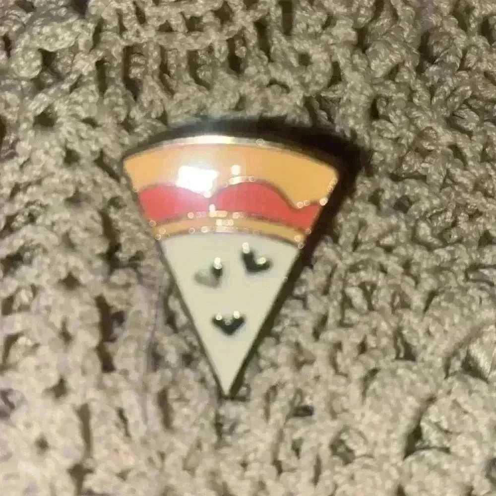 Novelty pin lot, including 1 Pokémon pin
